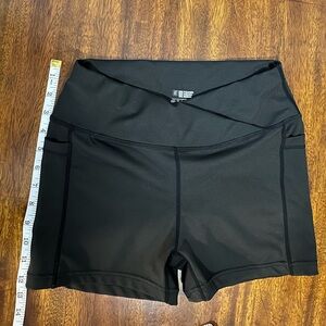 Black bike shorts with pockets and “V” waist